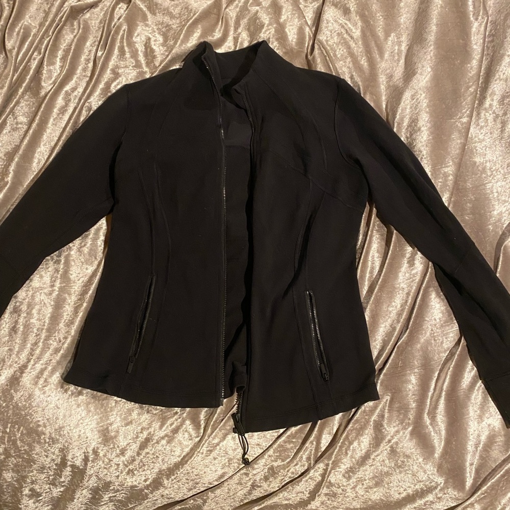 Lululemon black jacket size 14. Worn once. Great condition.